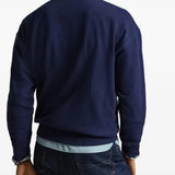 Navy shirts worn by a person, showing the shirts fit