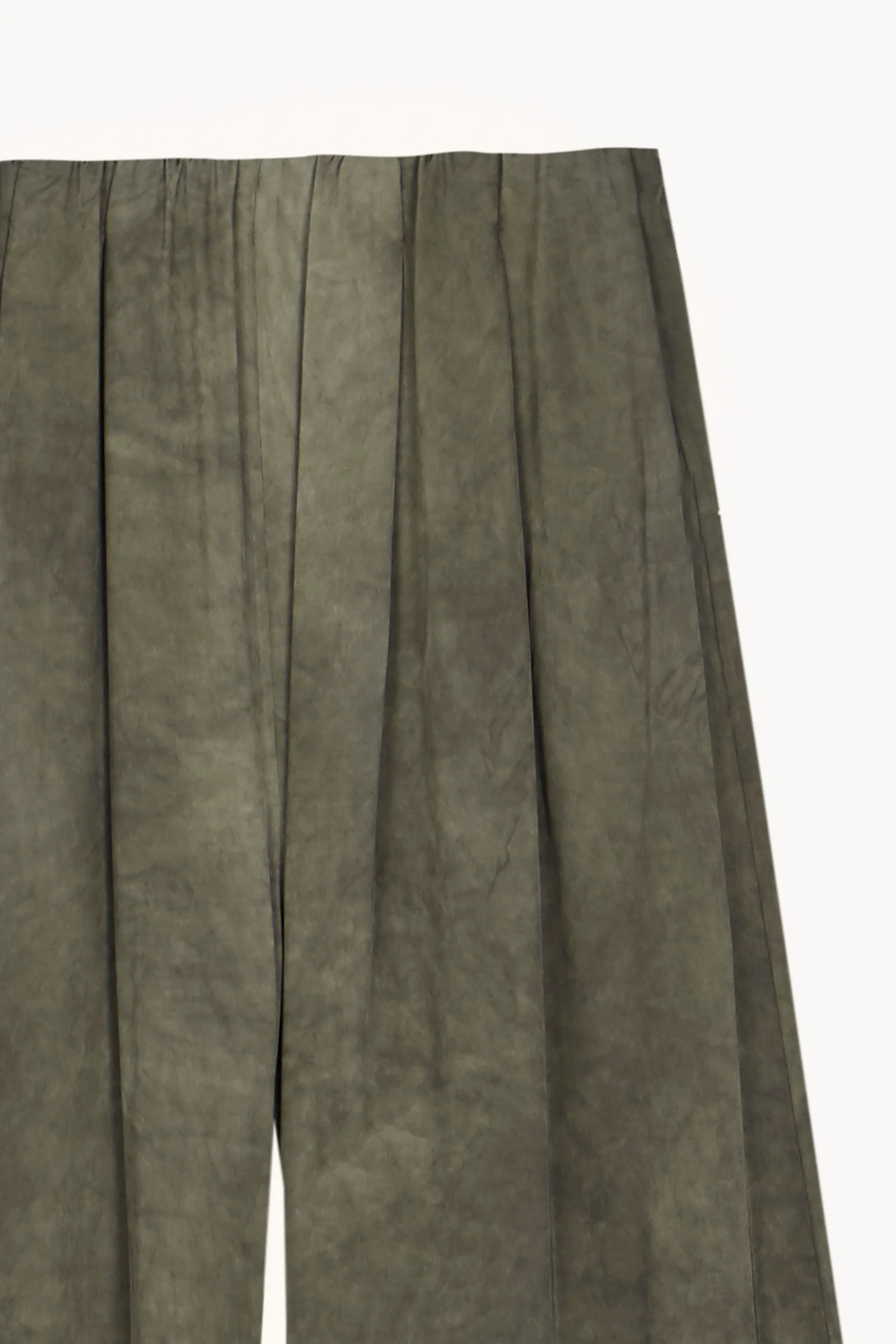 Close up of Green pants, showing texture of the 97% viscose/ 3% elastane fabric