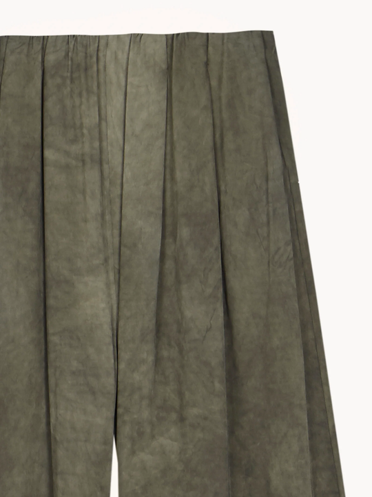 Close up of Green pants, showing texture of the 97% viscose/ 3% elastane fabric