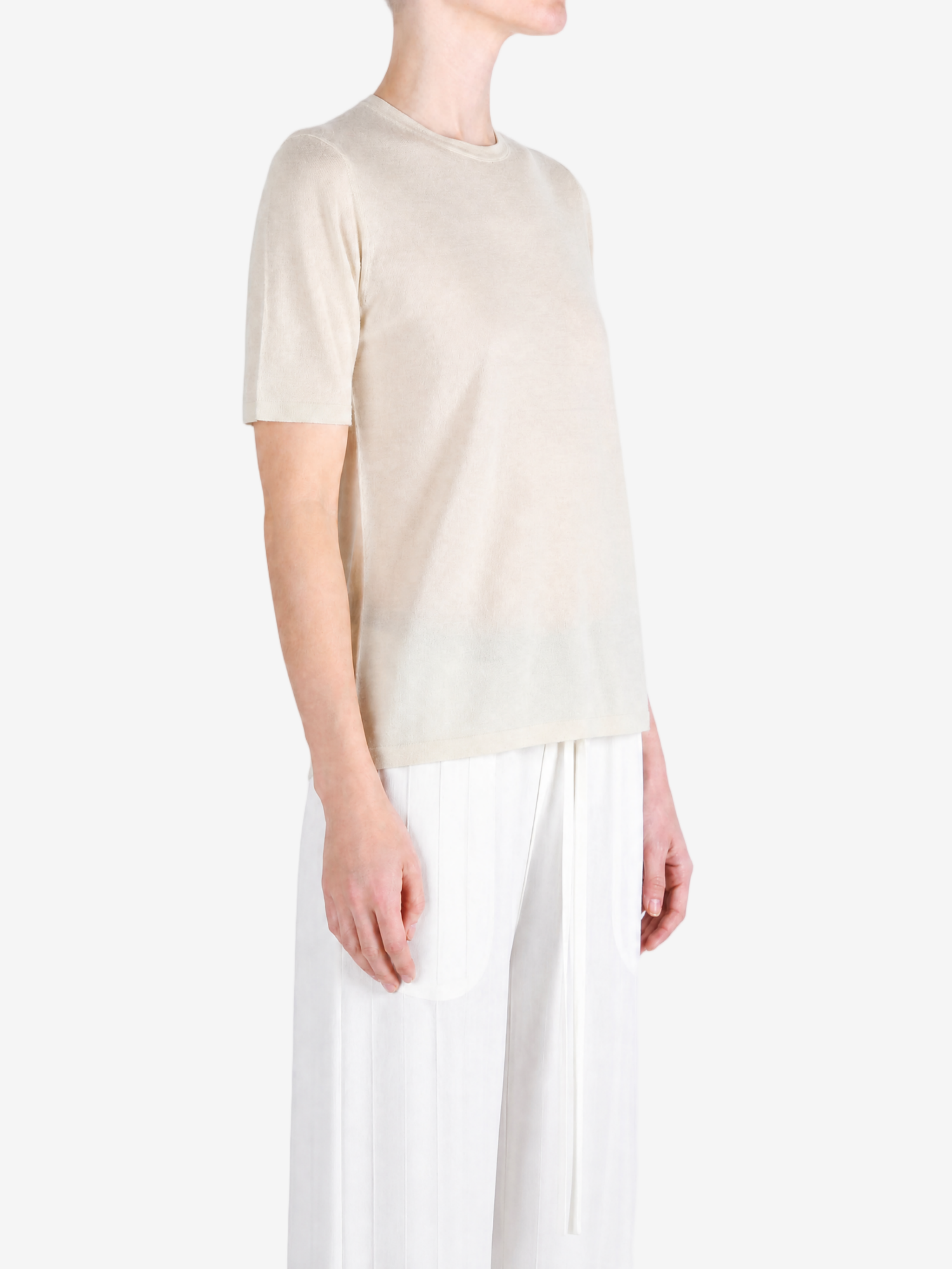 Tan t-shirt worn by a person, showing the t-shirt fit