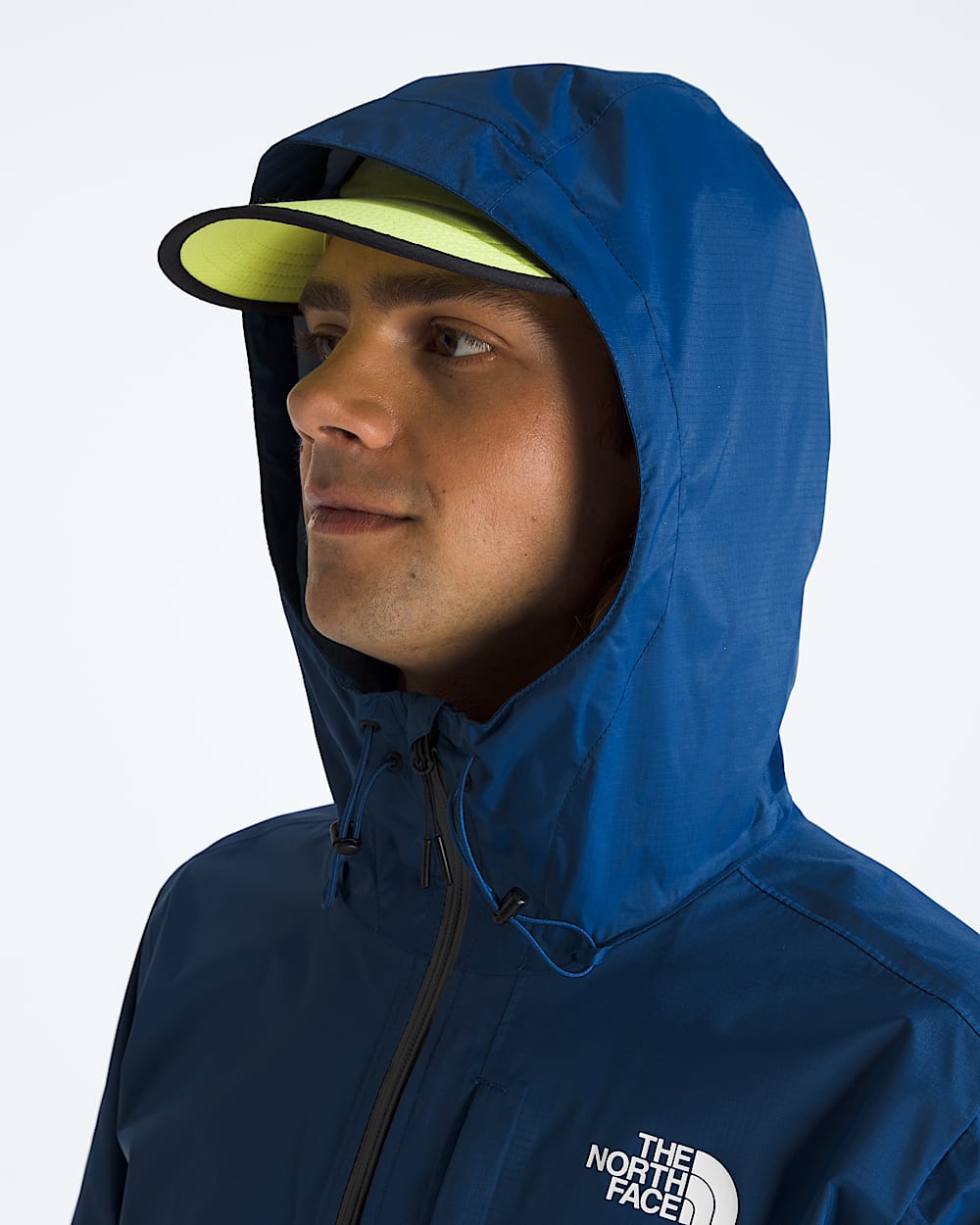 Blue jacket worn by a person, showing the jacket fit