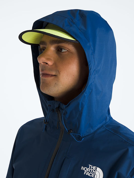 Blue jacket worn by a person, showing the jacket fit