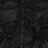 Close up of the black vest, showing texture of the polyamide fabric