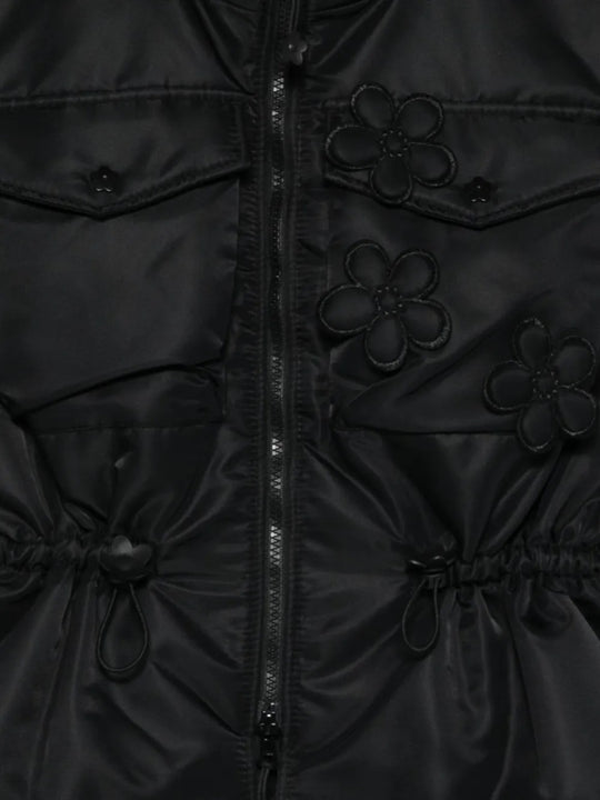Close up of the black vest, showing texture of the polyamide fabric