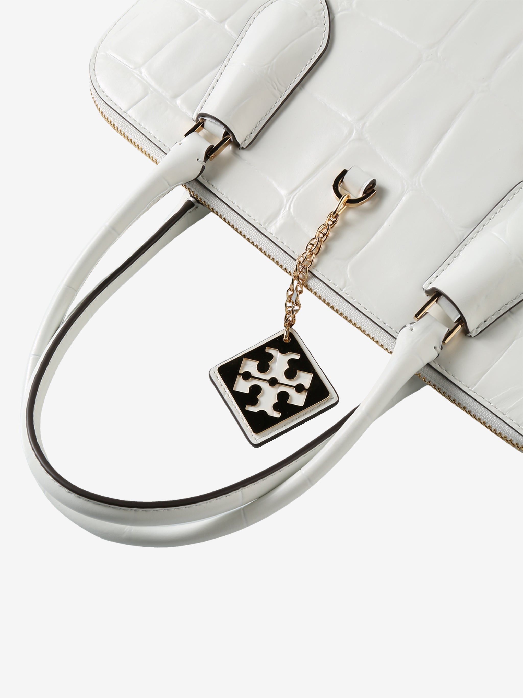 Close up of white bag, showing texture of the leather fabric