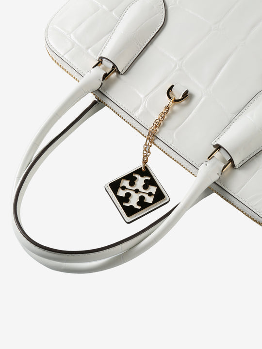 Close up of white bag, showing texture of the leather fabric