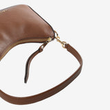 Close up of brown bag, showing texture of the cow leather fabric