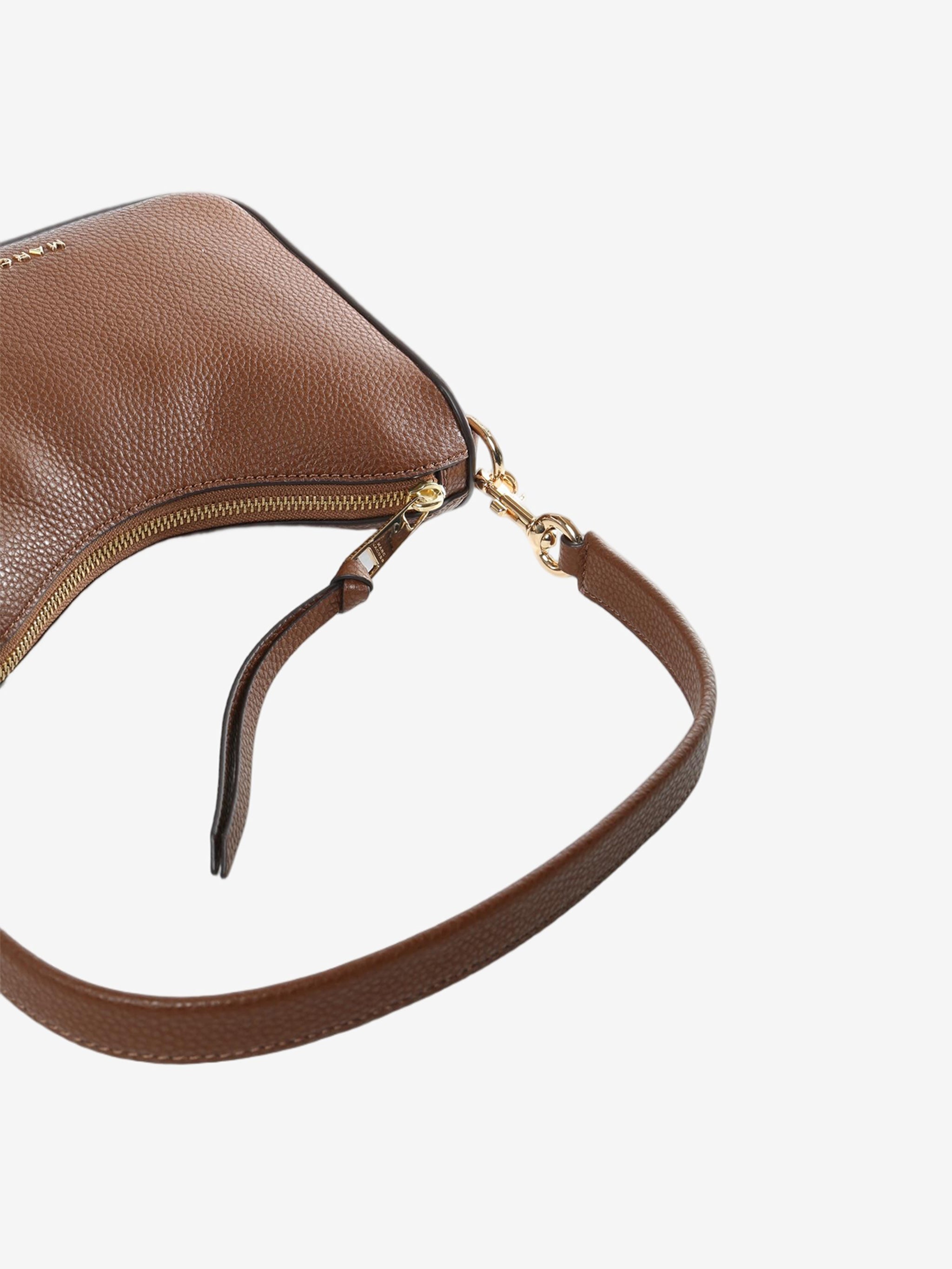 Close up of brown bag, showing texture of the cow leather fabric