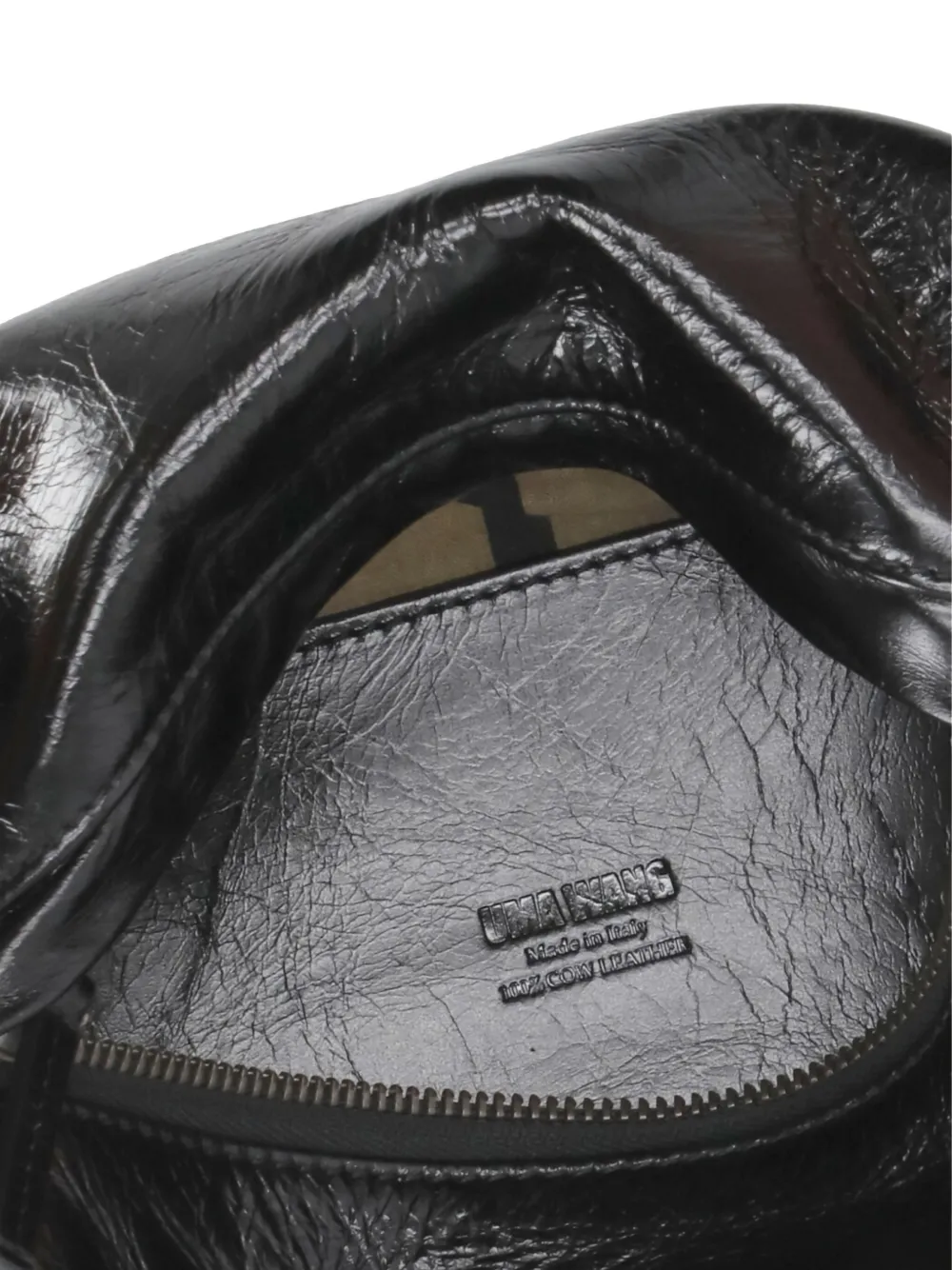Close up of the black bag, showing texture of the leather fabric
