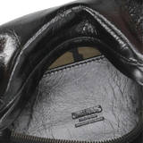 Close up of the black bag, showing texture of the leather fabric
