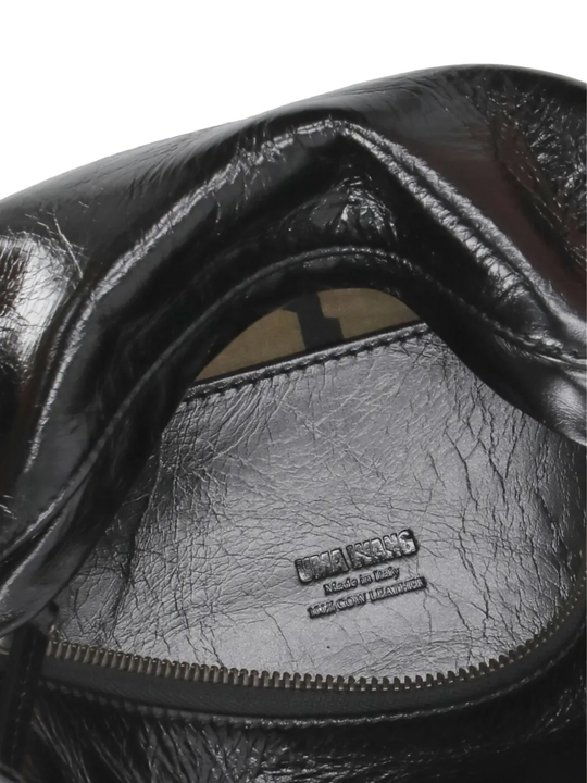 Close up of the black bag, showing texture of the leather fabric