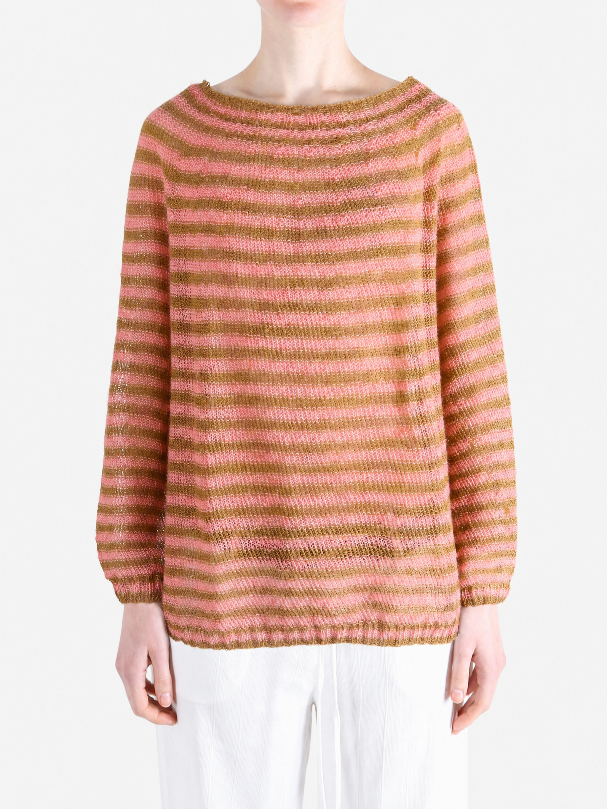 Pink knitwear worn by a person, showing the knitwear fit
