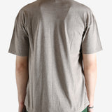 Brown t-shirt worn by a person, showing the shirt's fit
