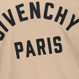 Close up of tan t-shirts, showing texture of the cotton fabric