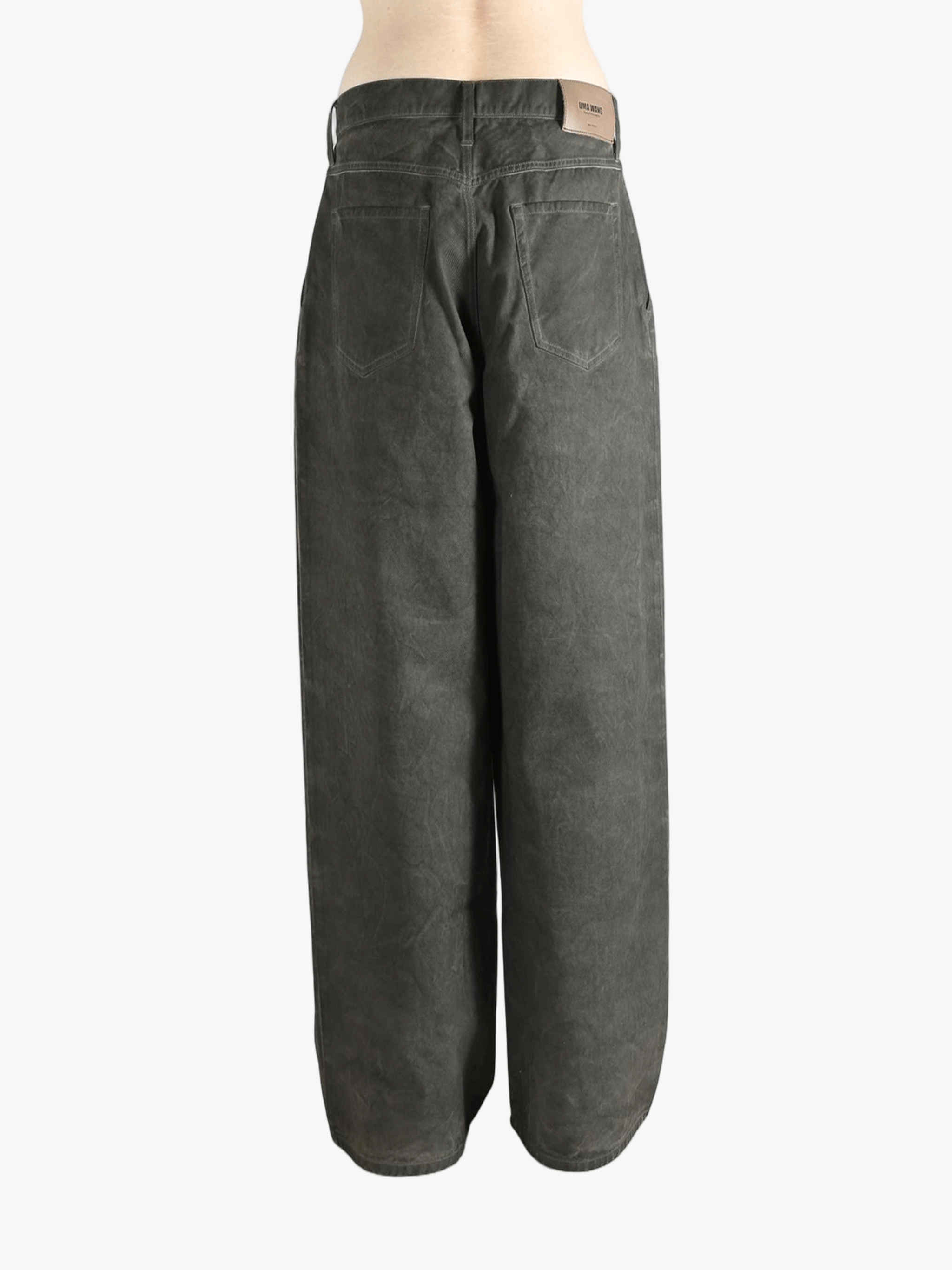 Grey pants worn by a person, showing the pants' fit