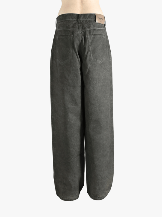 Grey pants worn by a person, showing the pants' fit