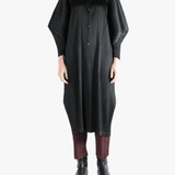 Black jackets-coats worn by a person, showing the jackets-coats'fit