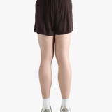 Brown shorts worn by a person, showing the shorts fit