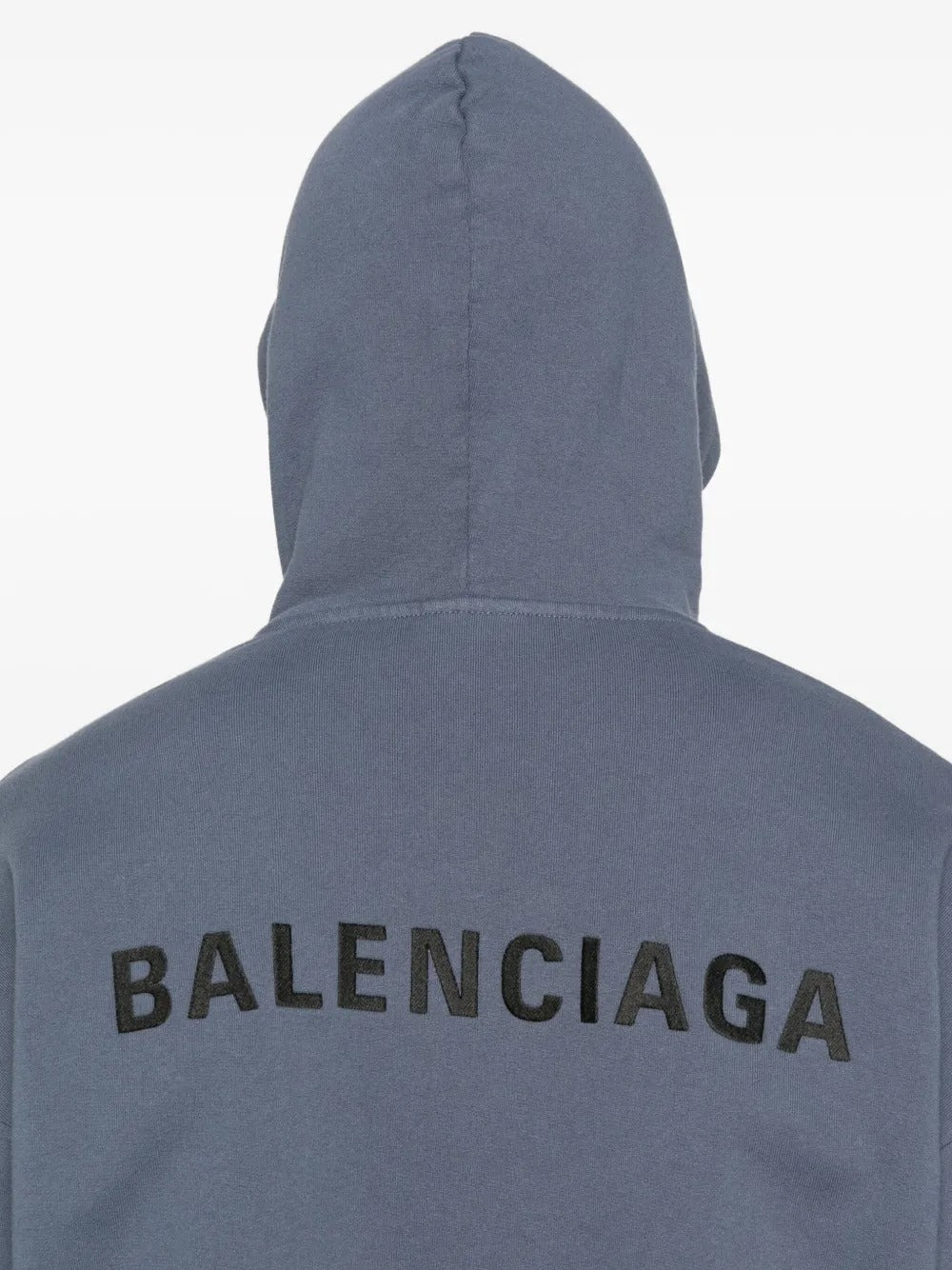 Close up of the blue hoodie, showing texture of the cotton fabric