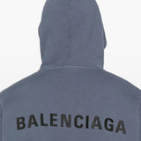 Close up of the blue hoodie, showing texture of the cotton fabric