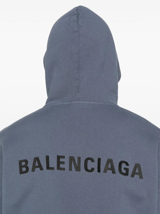 Close up of the blue hoodie, showing texture of the cotton fabric