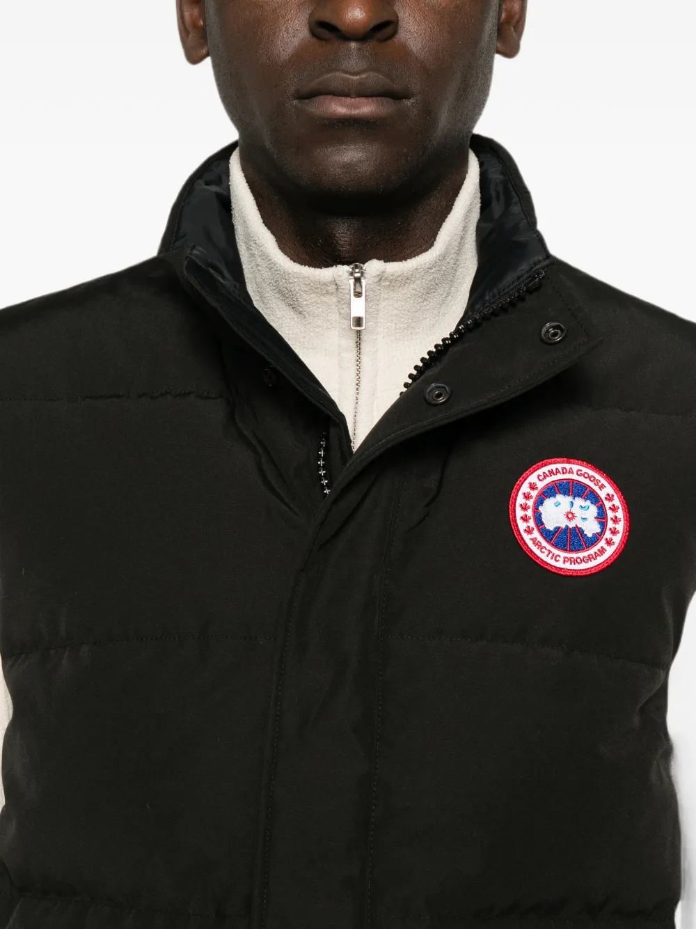 Black jacket worn by a person, showing the jacket fit