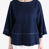 Navy top worn by a person, showing the top fit