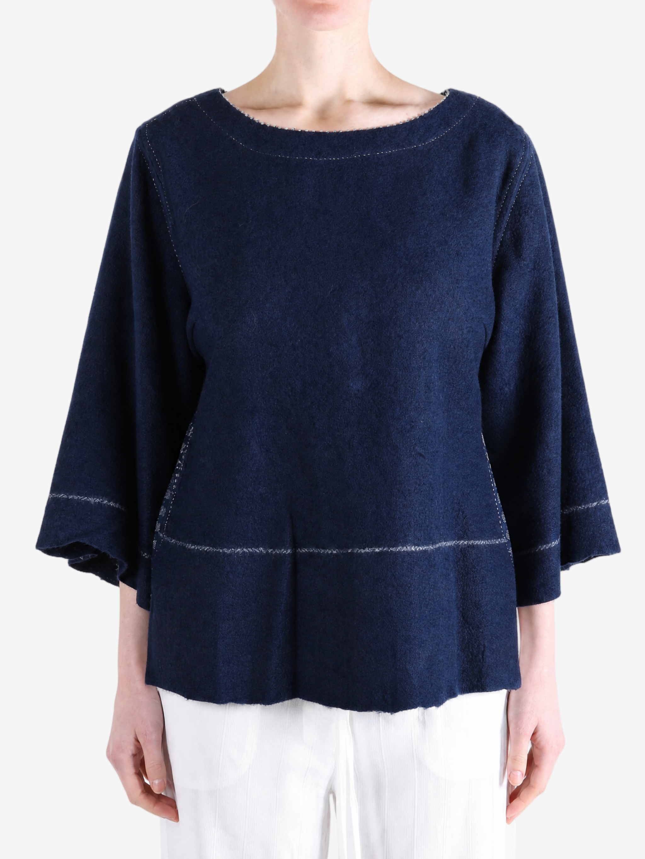 Navy top worn by a person, showing the top fit