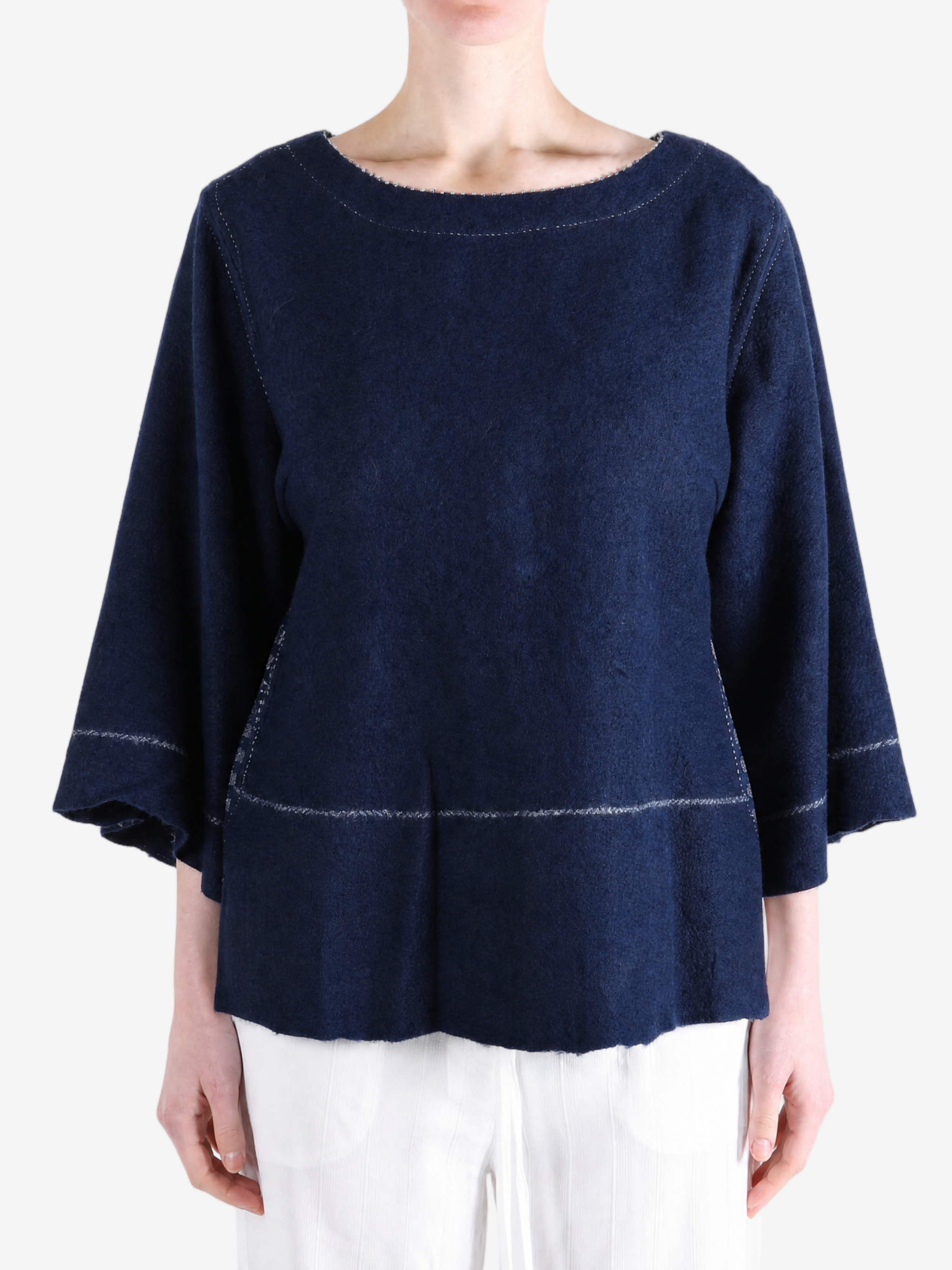 Navy top worn by a person, showing the top fit