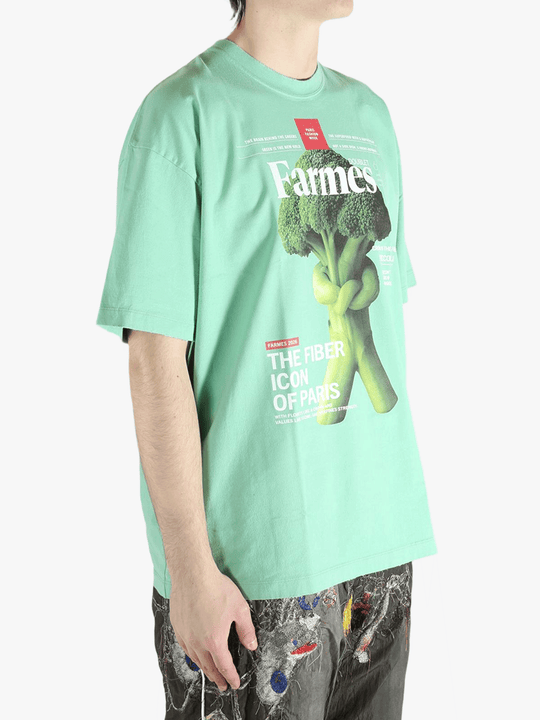 Green t-shirt worn by a person, showing the t-shirt's fit