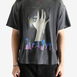 Black t-shirt worn by a person, showing the t-shirt's fit