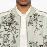 Green jackets-coat worn by a person, showing the jackets-coat's fit