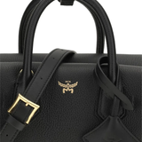 Close up of black bag, showing texture of the leather fabric