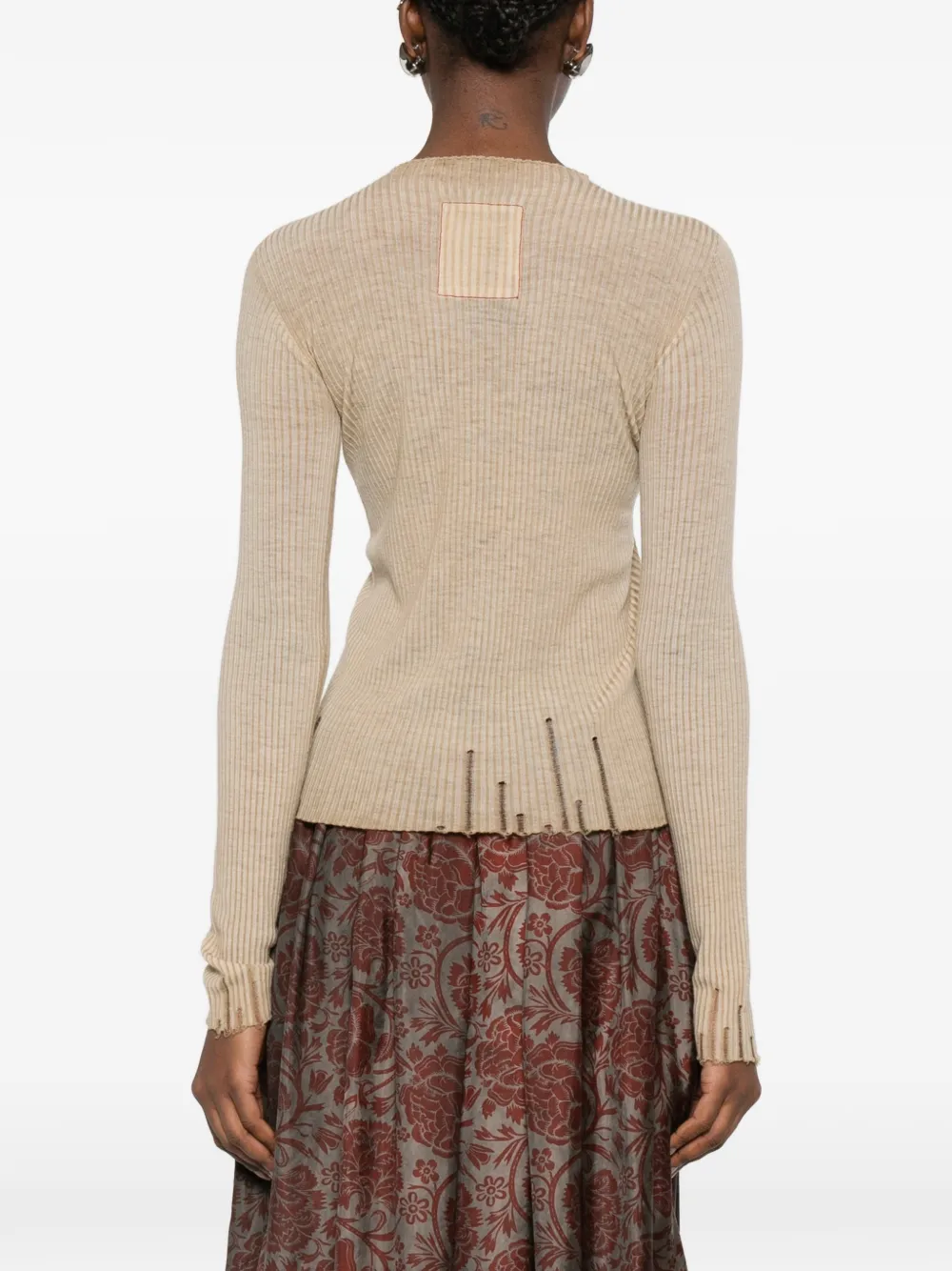 Tan tops worn by a person, showing the tops fit