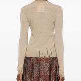 Tan tops worn by a person, showing the tops fit