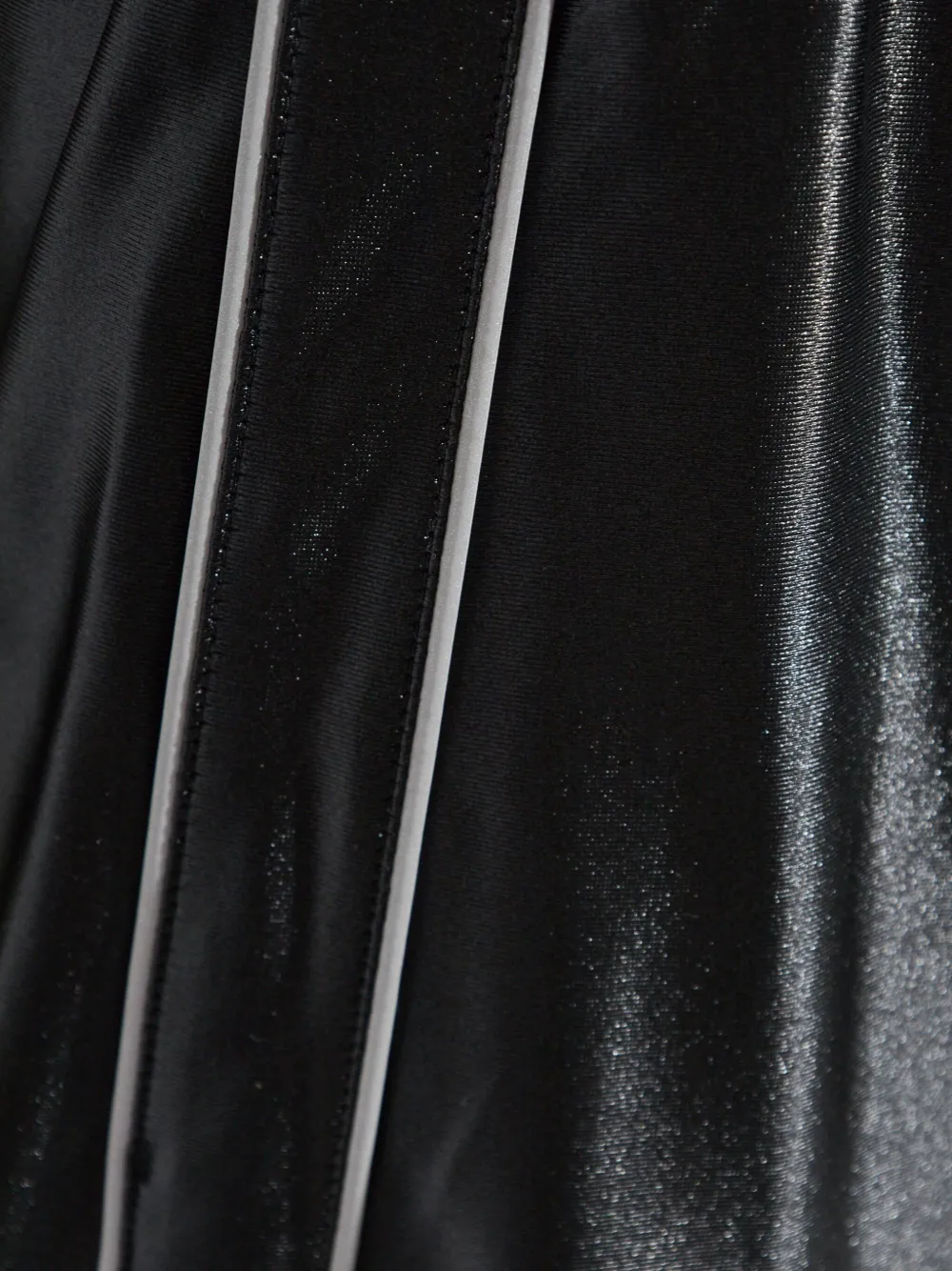 Close up of black pants,showing texture of the cotton fabric.