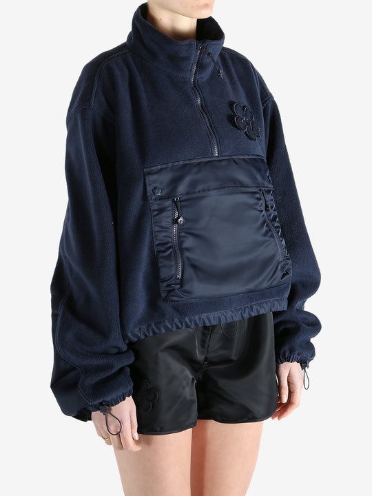 Navy jacket worn by a person, showing the jacket's fit