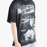 Black t-shirts worn by a person, showing the t-shirts fit