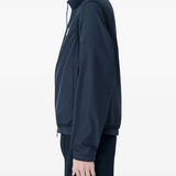 blue jackets-coats worn by a person,show the jackets-coats fit