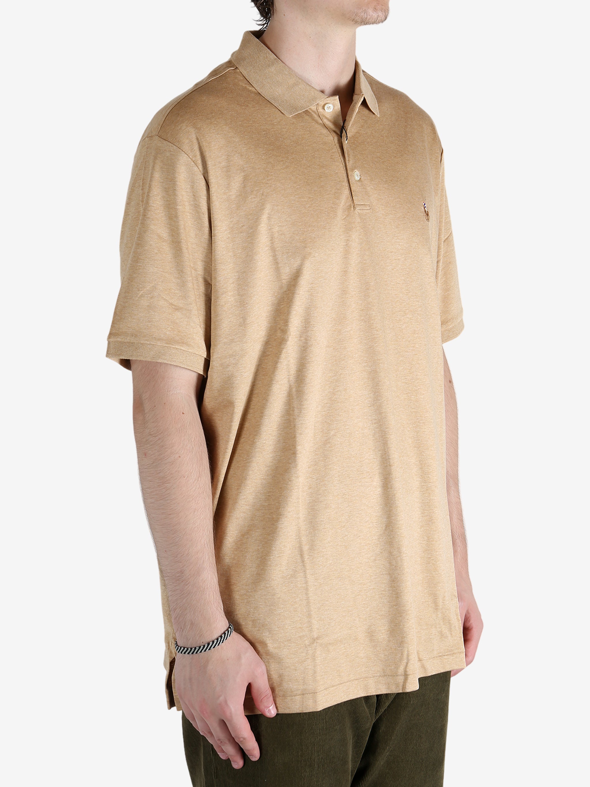 Tan t-shirt worn by a person, showing the shirt's fit