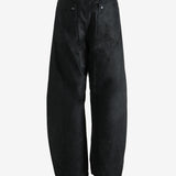 Black pants worn by a person, showing the pants fit