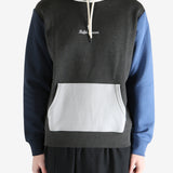 Color-blocked hoodie worn by a person, showing the hoodie fit