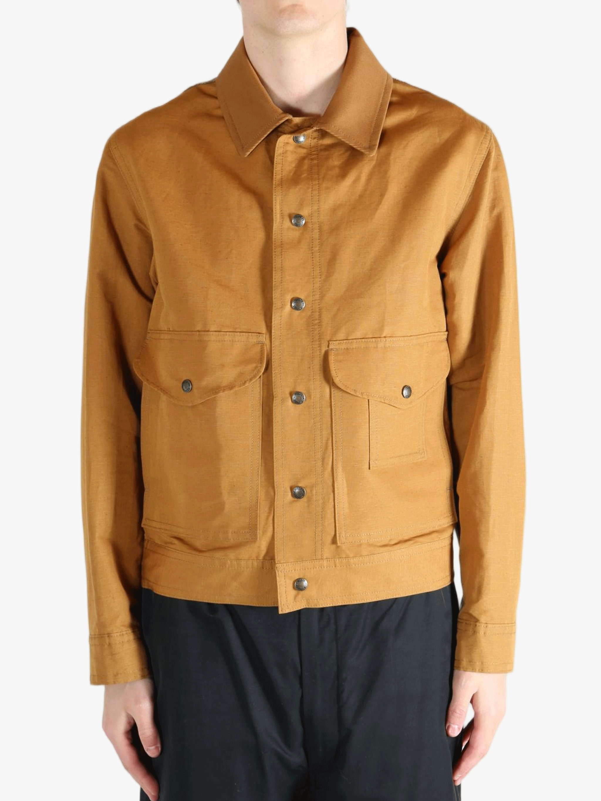Brown jackets worn by a person, showing the jacket's fit 