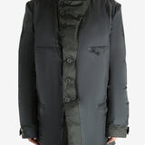 Black jacket worn by a person, showing the jacket's fit