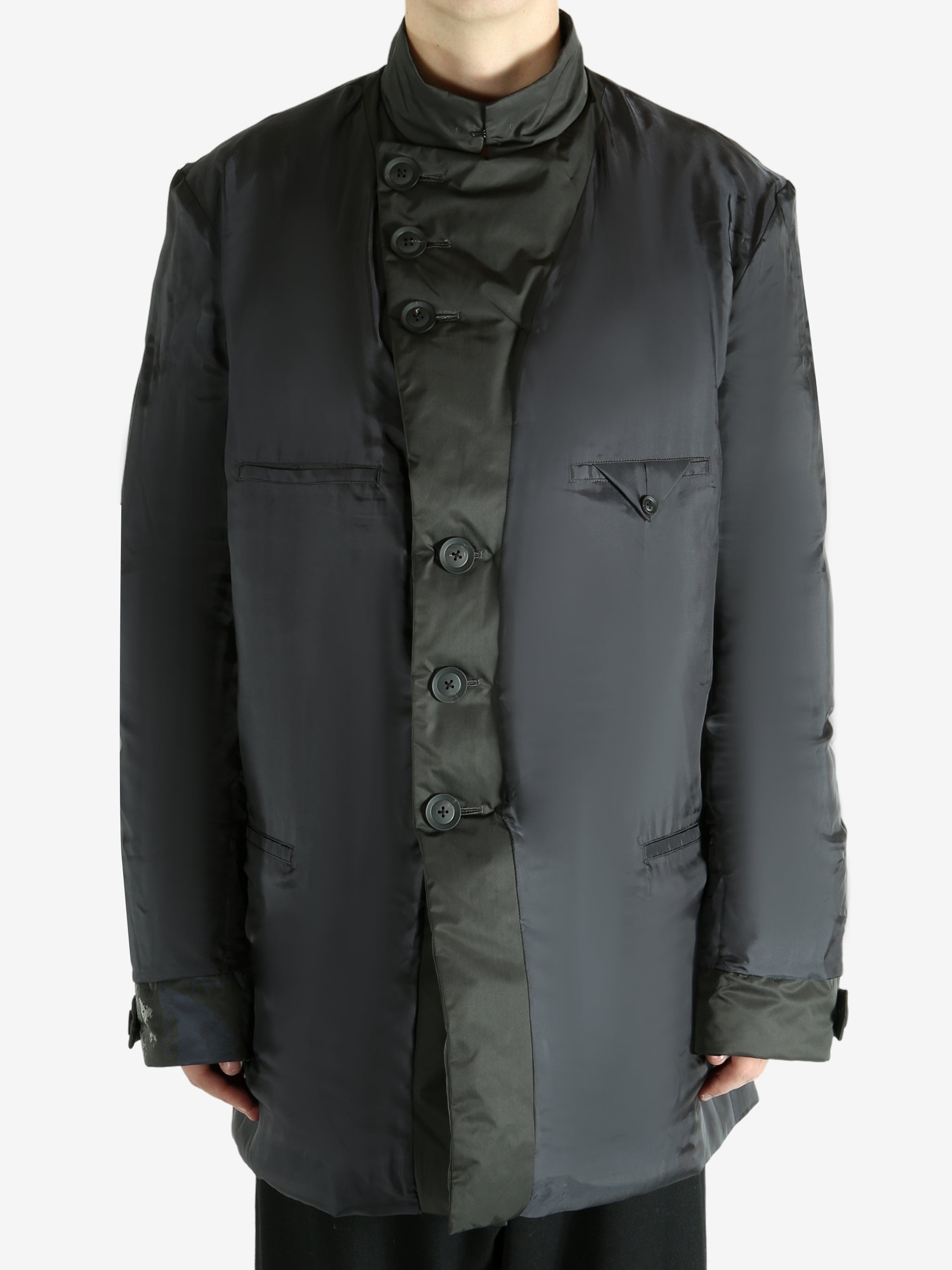 Black jacket worn by a person, showing the jacket's fit