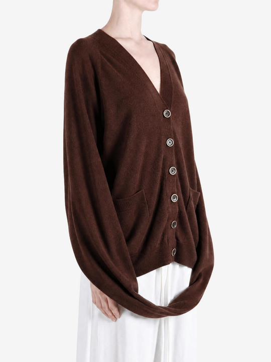 Brown knitwear worn by a person, showing the knitwear fit