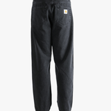 Black pant worn by a person, showing the pant's fit