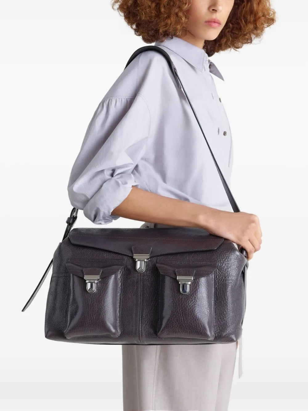 Brown bag carried by a person, showing the bag fit