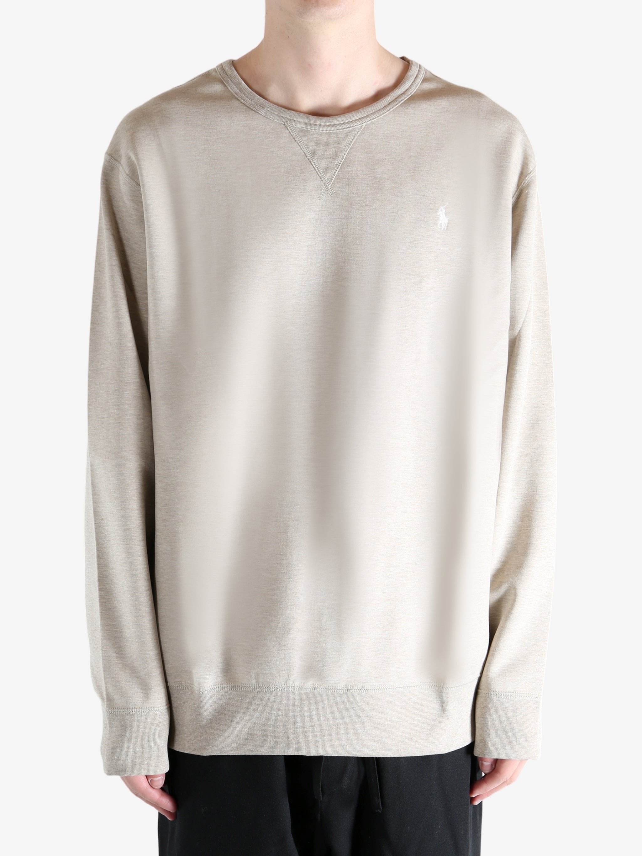 Tan shirts worn by a person, showing the shirts fit