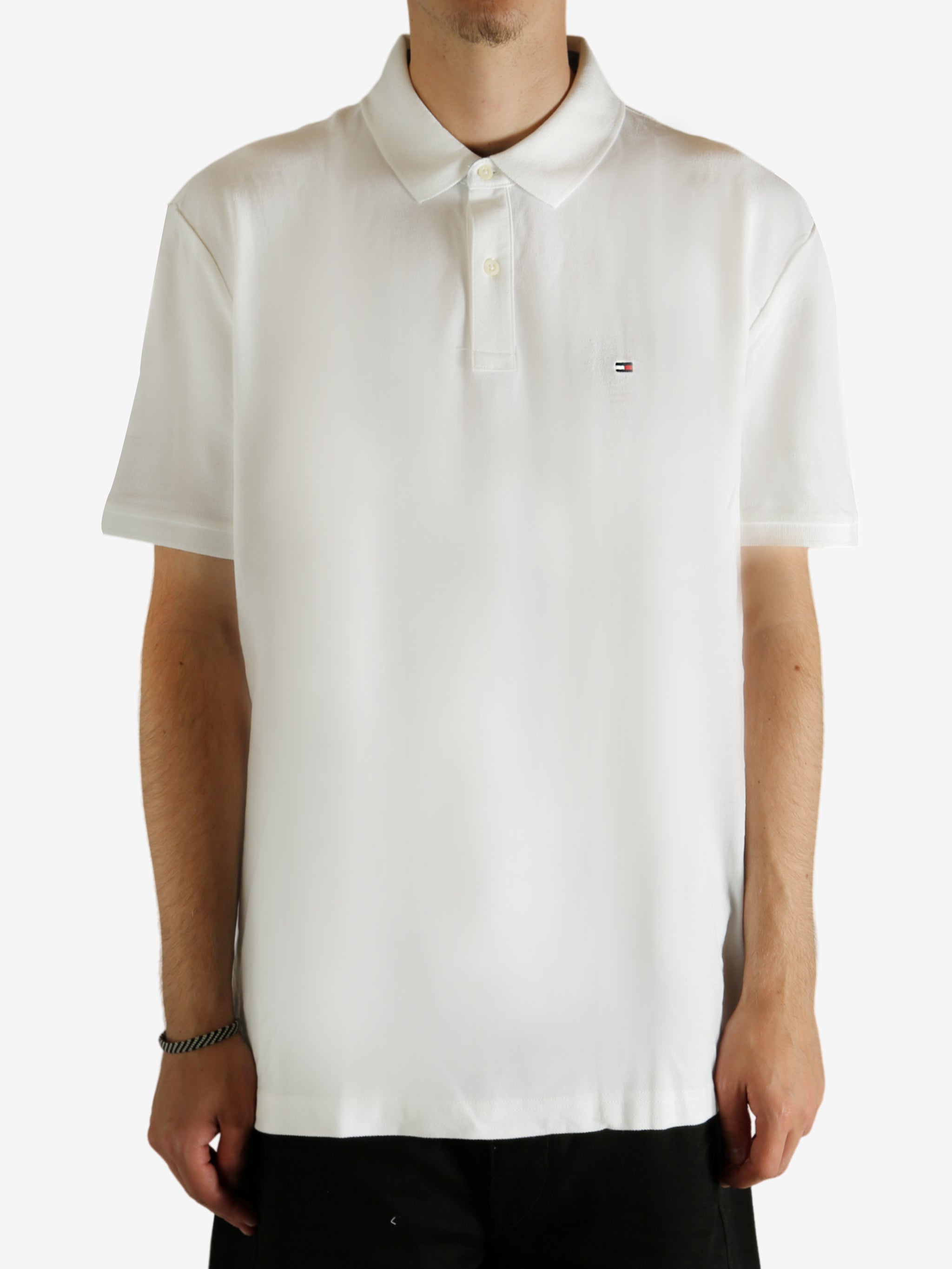 White shirt worn by a person, showing the shirt fit